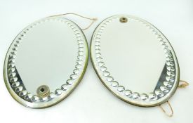 Decorative pair of oval antique fancy bevelled and circular cut mirrors,