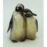 Royal Doulton pair cuddling penguins in natural colours, height 15.