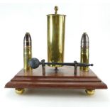 Trench Art brass dinner gong on wooden base with brass feet, 37cm.