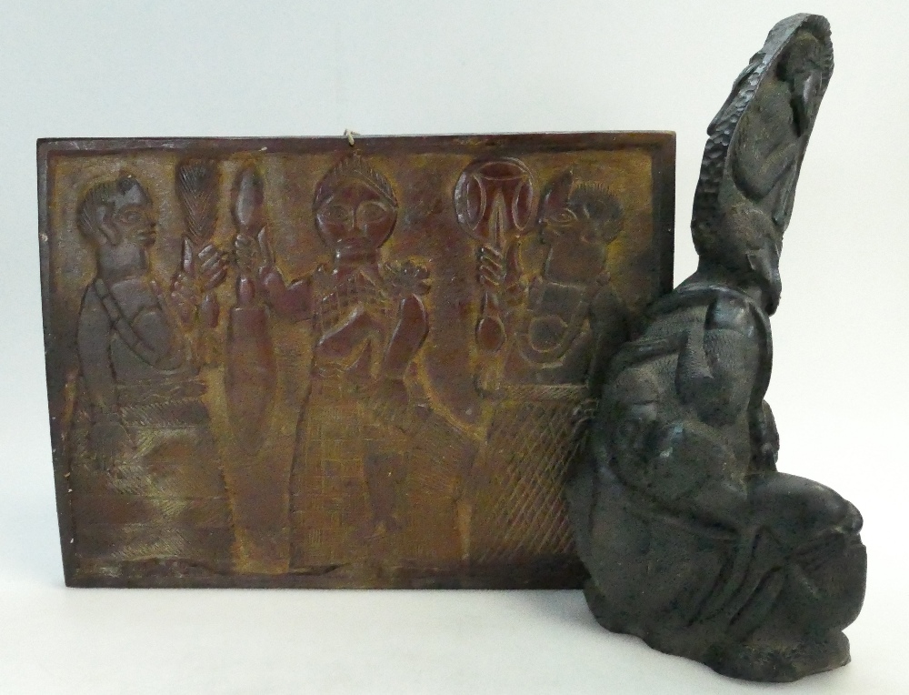19th Century Heavy Carved African figure together with similar panel with depiction of 3 tribal