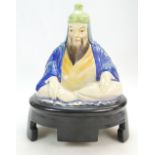 Royal Doulton speaker cover modelled as a seated Budha painted in various colours,