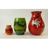 A collection of Poole Pottery vases to include mottled orange,