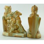 A pair of Henry Richards Tile Co child knight stoneware bookends in a rich orange/brown and green