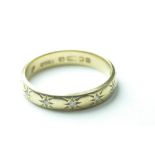 18ct hallmarked gold & 7 diamond set eternity ring, size P. 3.9g.