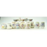 A collection of Poole Pottery floral decorated small vases in varying shapes (14)