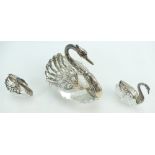 Group of three glass crystal swans, the larger having silver coloured metal wings stamped 925,