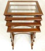 Edwardian mahogany nest of four tables with glass top (damage to 2 stretchers)