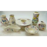 A collection of Poole Pottery floral decorated items to include vases, planters,