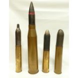 Four large brass artillery shell casings, 90cm.