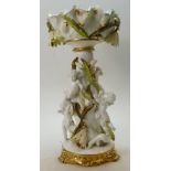 Moore Brothers large centrepiece decorated with various cherubs around a tree trunk with painted