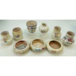 A collection of Poole Pottery floral decorated vases,