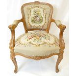 Louis XV style carved oak and needlepoint armchair