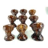 Group of 9 treacle glazed 19th century pottery FURNITURE RESTS all modelled as a female head,