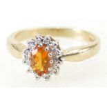 9ct Gold ladies Dress ring set with Diamonds and orange semi-precious stone, size L,