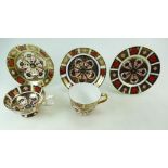 Royal Crown Derby trio and a cup and saucer all decorated in the Old Imari 1128 design (5)