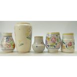 A collection of floral decorated Poole Pottery vases of varying shapes (height of largest 23cm) (5)