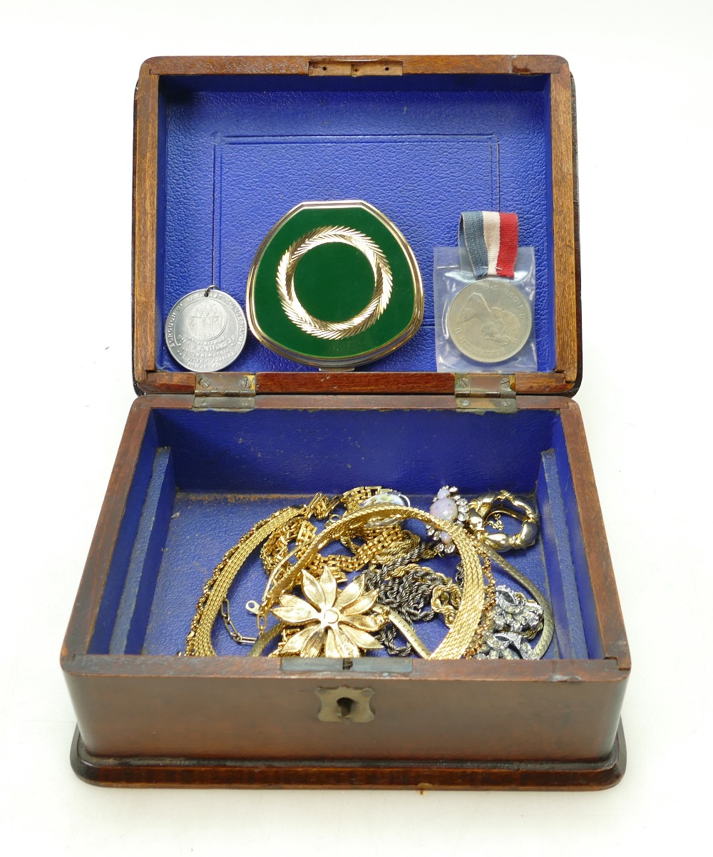 Edwardian oak box containing costume jewellery, chains, necklaces,