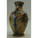 Royal Doulton Lambeth stoneware vase decorated with scrolling foliage and embossed flower heads,