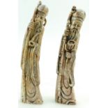 Two carved soapstone Chinese CHOPS or SEALS in the form of immortals, 15cm & 15.5cm high.