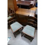 A 20th century oak drop leaf dining table and four matching ladderback dining chairs. (5).