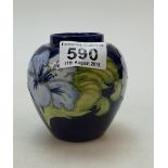 Unusual small Moorcroft Hibiscus on blue ground vase 10cm high.