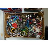 A large quantity of costume jewellery items to include necklaces, beads,