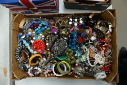 A large quantity of costume jewellery items to include necklaces, beads,