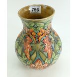 A Moorcroft vase decorated in the Flame of the Forest design,