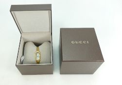 Ladies Gucci stainless gold plated designer wristwatch,