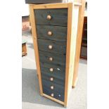 A modern pine tall boy style chest of 8 drawers