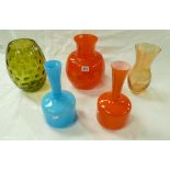 A collection of mid century and later glass ware vases in oranges, yellows, greens and blues.