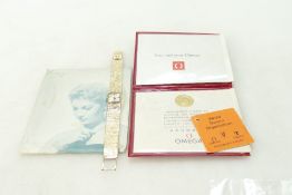 Omega 9ct gold ladies wristwatch and bracelet with original international guarantee dated 1970,