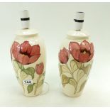 A pair of Moorcroft large lampbases decorated in the pink magnolia design,