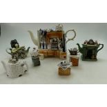 A collection of Cardew type novelty type tea pots to include The Pottery Market Stall, Fireplace,