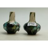 Pair of small Moorcroft vases decorated with flowers, height 11.