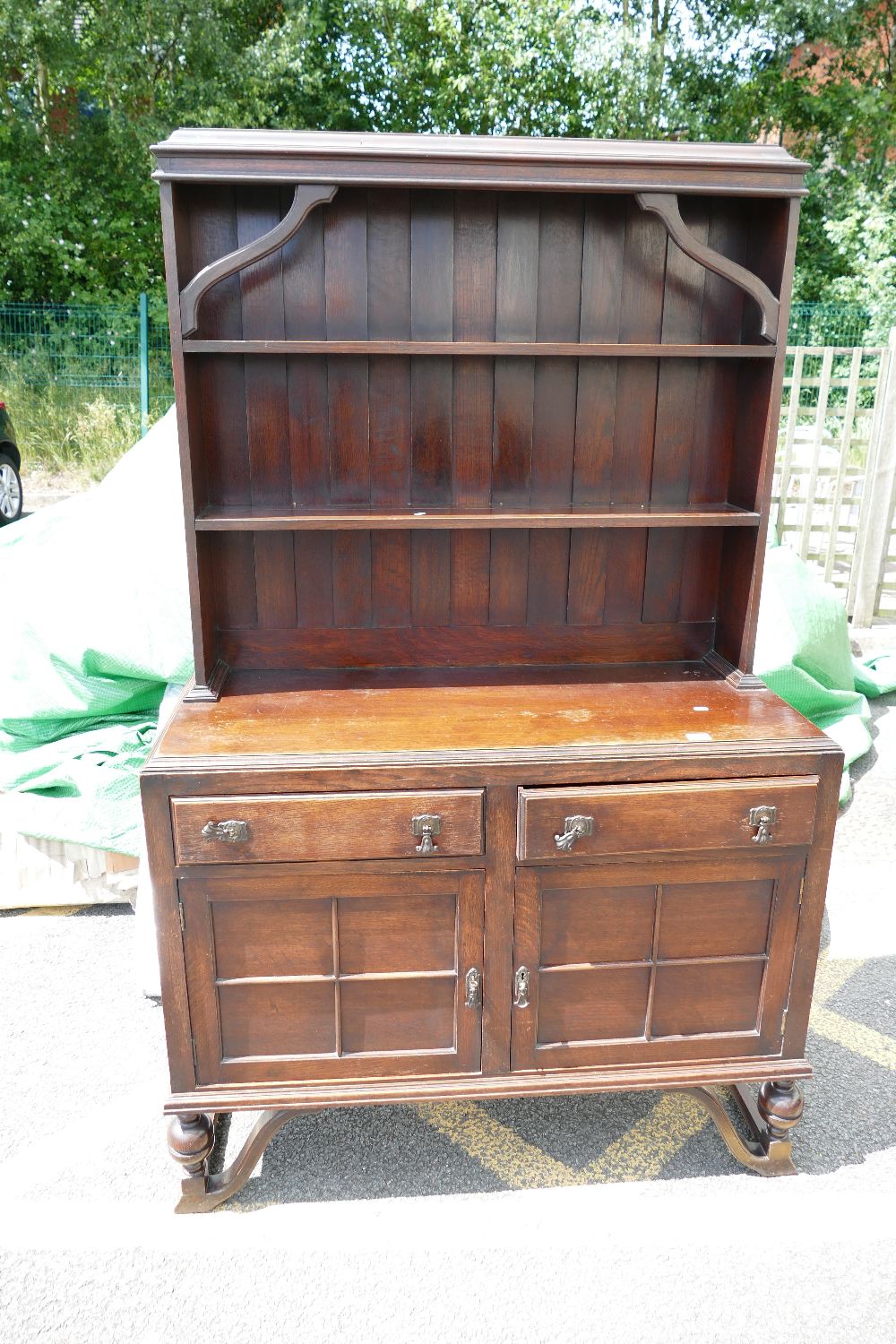 A oak 20th century two over two dresser on open legged base.