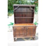 A oak 20th century two over two dresser on open legged base.