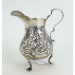 Silver ornate jug, hallmarked London 1876, 84.