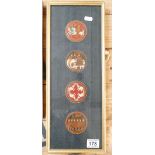 A framed Asian themed set of four discs with Ottoman design.