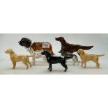 A collection of Beswick dogs to include St.