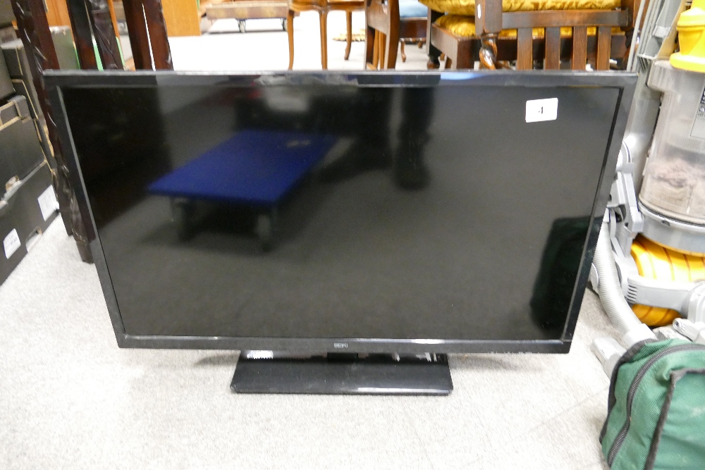 A Seike 32" TV, with remote.