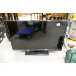 A Seike 32" TV, with remote.