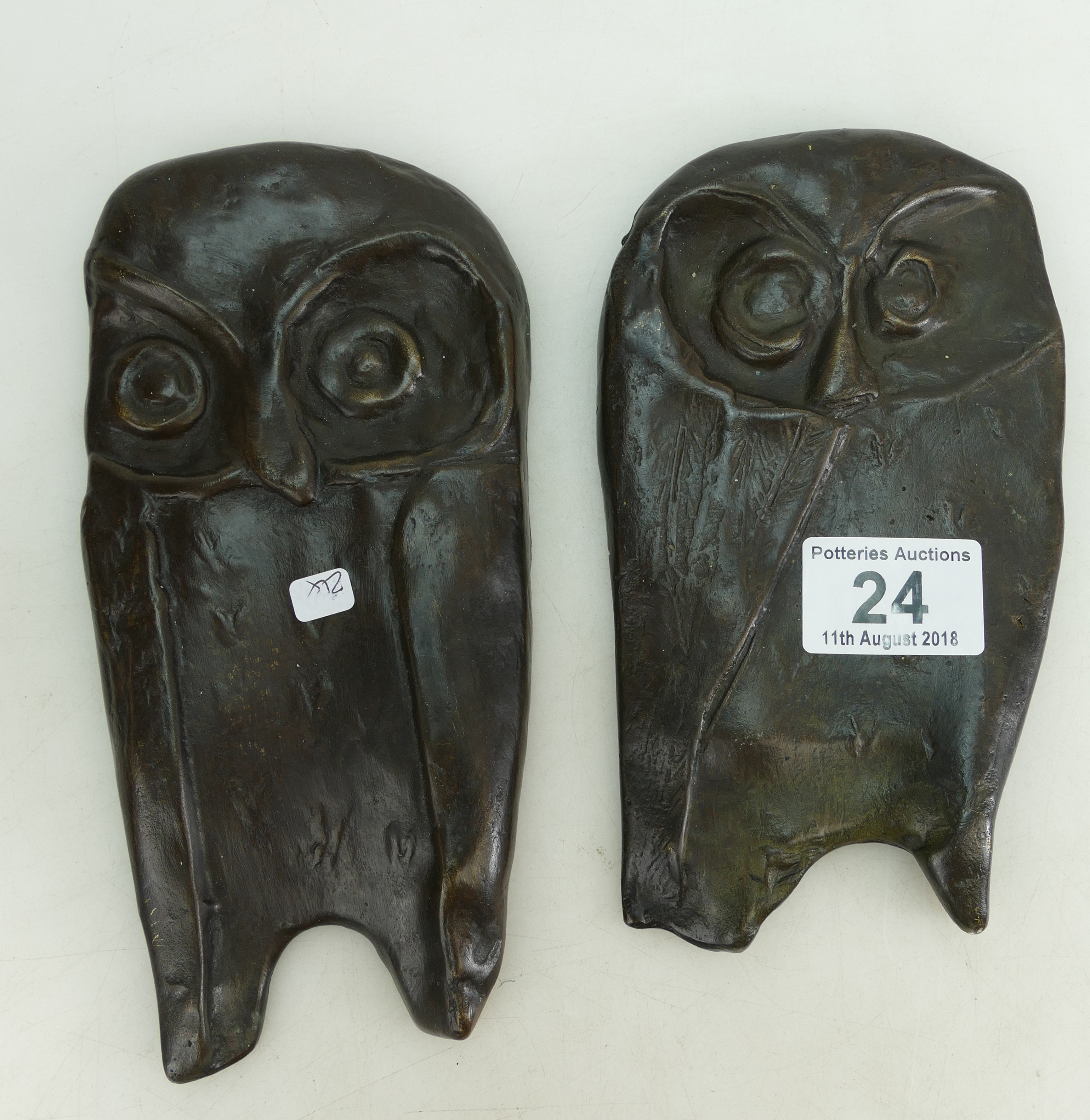 Two patinated bronze sculptures fashioned as owls