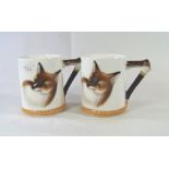 A pair of Royal Doulton Reynard the Fox coffee can