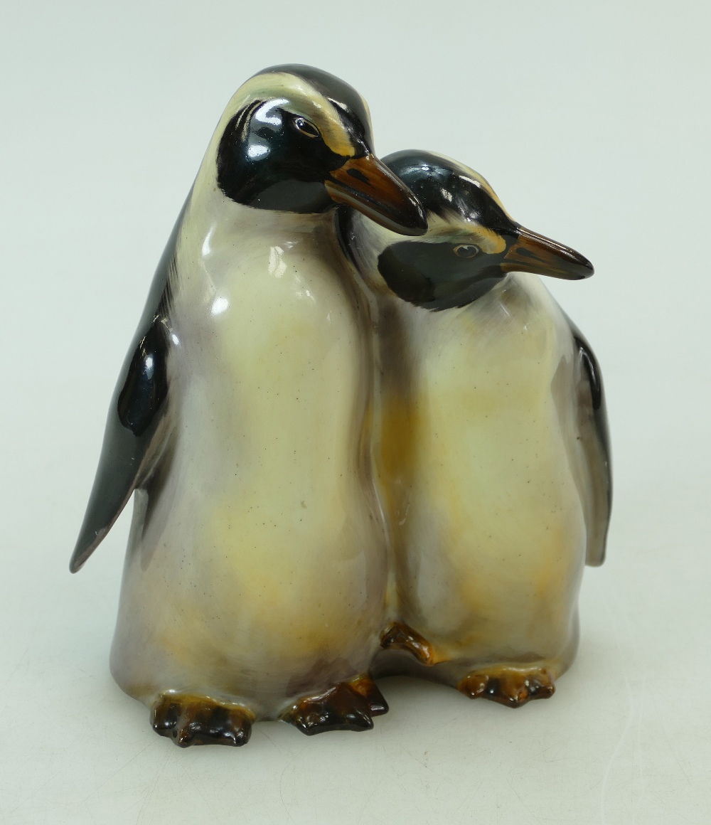 Royal Doulton pair cuddling penguins in