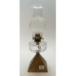 20th century oil lamp with owl motif to base