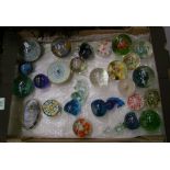 A collection of Caithness and other branded glass paperweights including date cored Millefiori