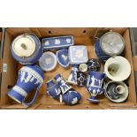 A good collection of early Wedgwood Jasperware in various shades of blue to include vases, urns,