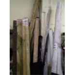 Large collection of lengthy items to include wooden patio beams and flagging, plastic tubes,