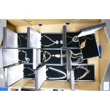 A collection of cased costume jewellery necklaces. (10)